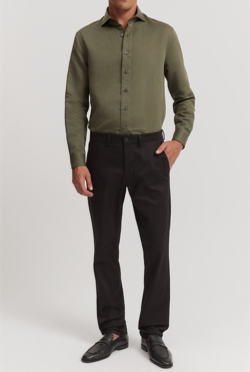 Dark green shirt with pleats combined with a grey pleated trouser. | Dark green  shirt, Green shirt, Mens tops